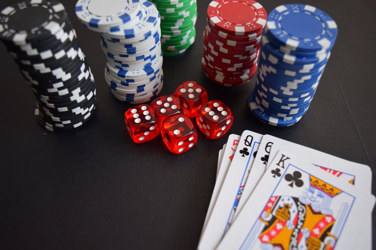 home-hero A vibrant display of casino chips, dice, and playing cards set on a table, embodying chance and excitement.