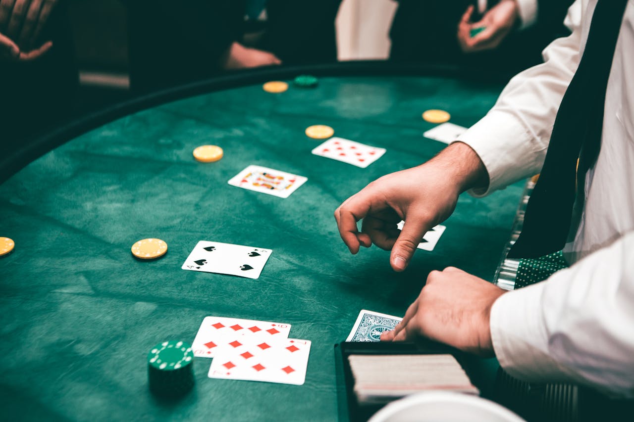 why-choose-us Casino scene with dealer and players, featuring cards and chips, creating a suspenseful atmosphere.
